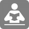 Icon of person reading a book